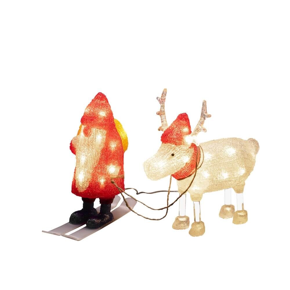 Leuchtende Konstsmide Acryl-weihnachtswichtel-figur mit warm-weißen Dioden und einem Rentier im Hintergrund