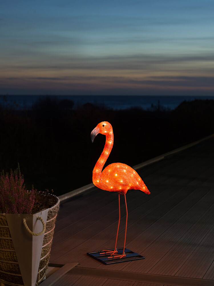 Leuchtende LED Acryl Flamingo von Konstsmide mit 48 bernsteinfarbenen Dioden. Klein und für den Außenbereich geeignet.