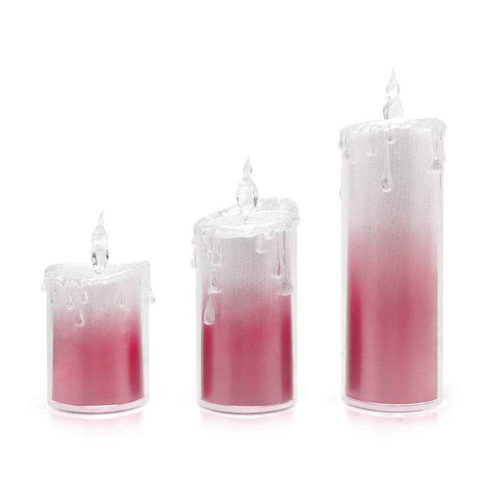 Funkelnde rosafarbene LED-Kerzen im 3er-Set von LED Universum, inklusive Fernbedienung und Timer