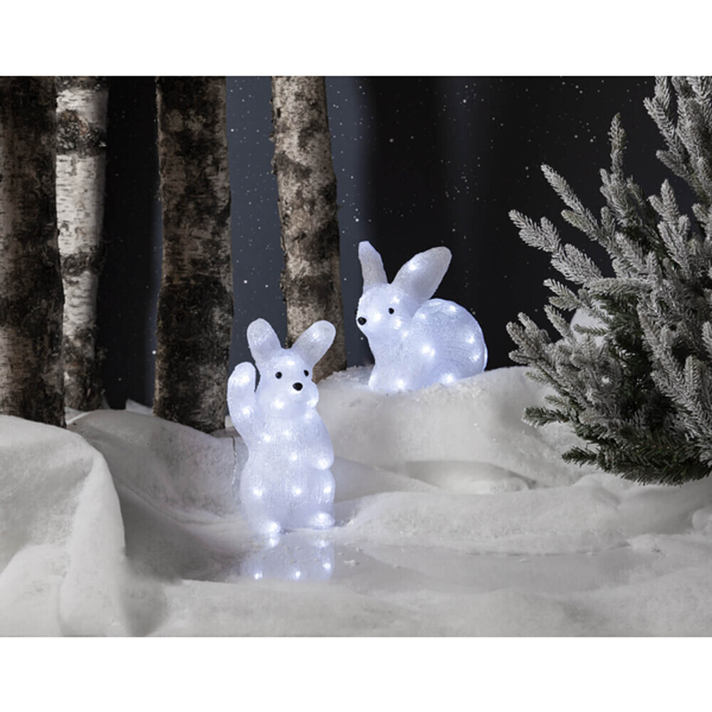 ansprechende weiße LED Leuchtfigur in Form eines liegenden Kaninchens von Star Trading