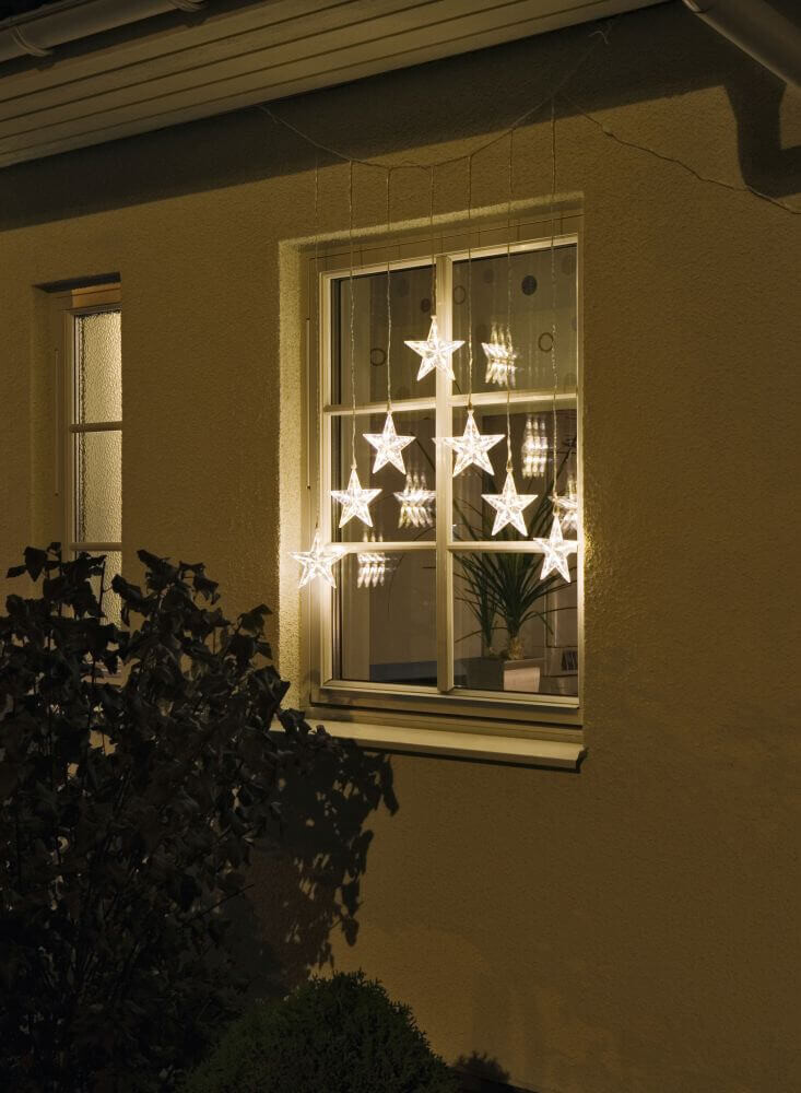 Konstsmide LED Lichtervorhang mit 7 Sternen, 35 warm weiße Dioden, 24V Außentrafo und transparentes Kabel