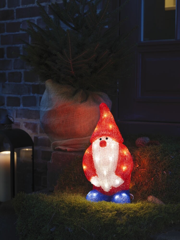 Eine strahlende Konstsmide Leuchtfigur in Form eines Weihnachtsmanns mit warmweißen Dioden für den Außenbereich