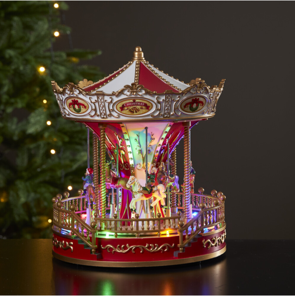Eine leuchtende Weihnachtskarussell-Figur von Star Trading mit mehrfarbigen, leuchtenden LED-Lichtern
