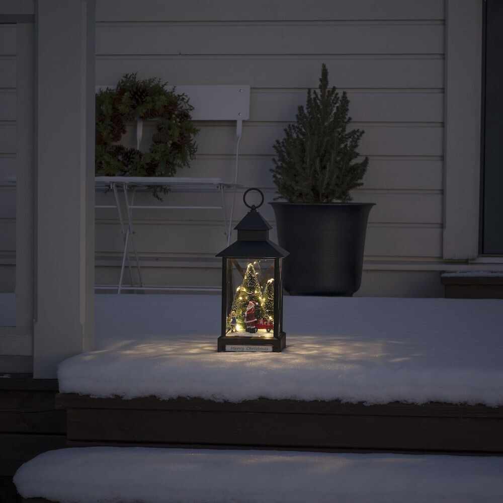 Hübsche kleine Konstsmide-Laterne mit Weihnachtsmann, Kind und Weihnachtsbaum Motiv, ausgestattet mit statischen und rotierenden warm-weißen LEDs